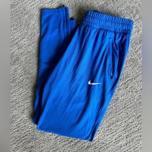 Nike athletic pants with pockets and ankle zipper